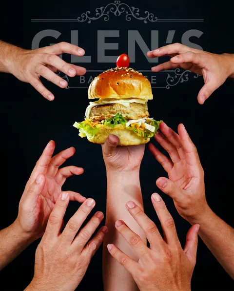 Striking brand post for Glen's Bakehouse with many hands reaching for a single burger on black