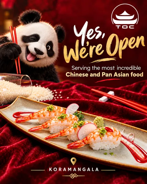 Grand opening post for TOC, a Chinese and Pan Asian restaurant, with a playful panda and a plate of prawn nigiri on red velvet
